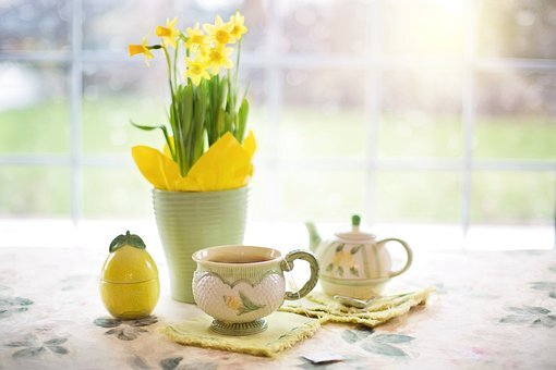 Yellow flowers and a watering can