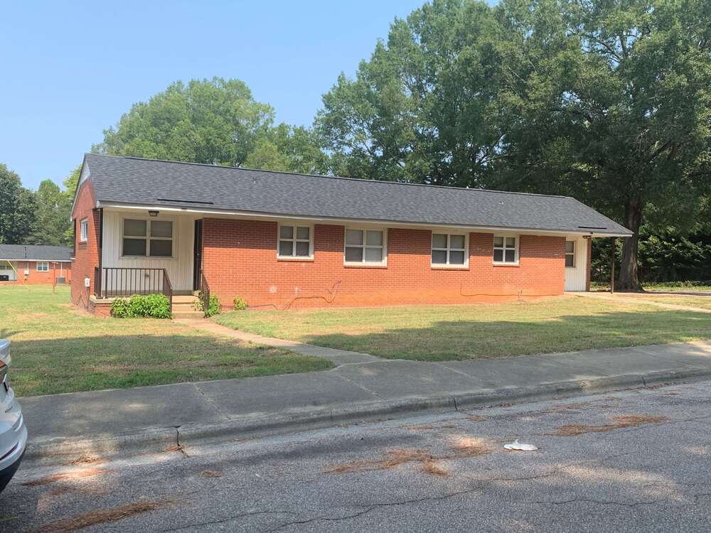 new hope village home exterior in the sun