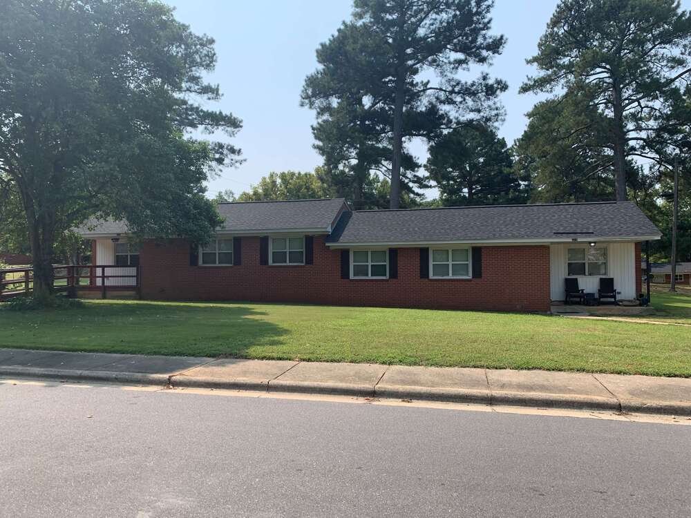 new hope village home exterior with lawn